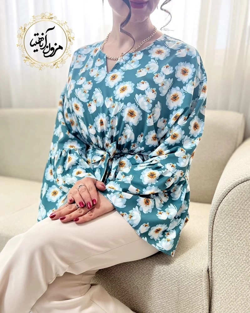 شومیز آستین کلوش سبز فیروزه ای طرح گلهای سفید دینا