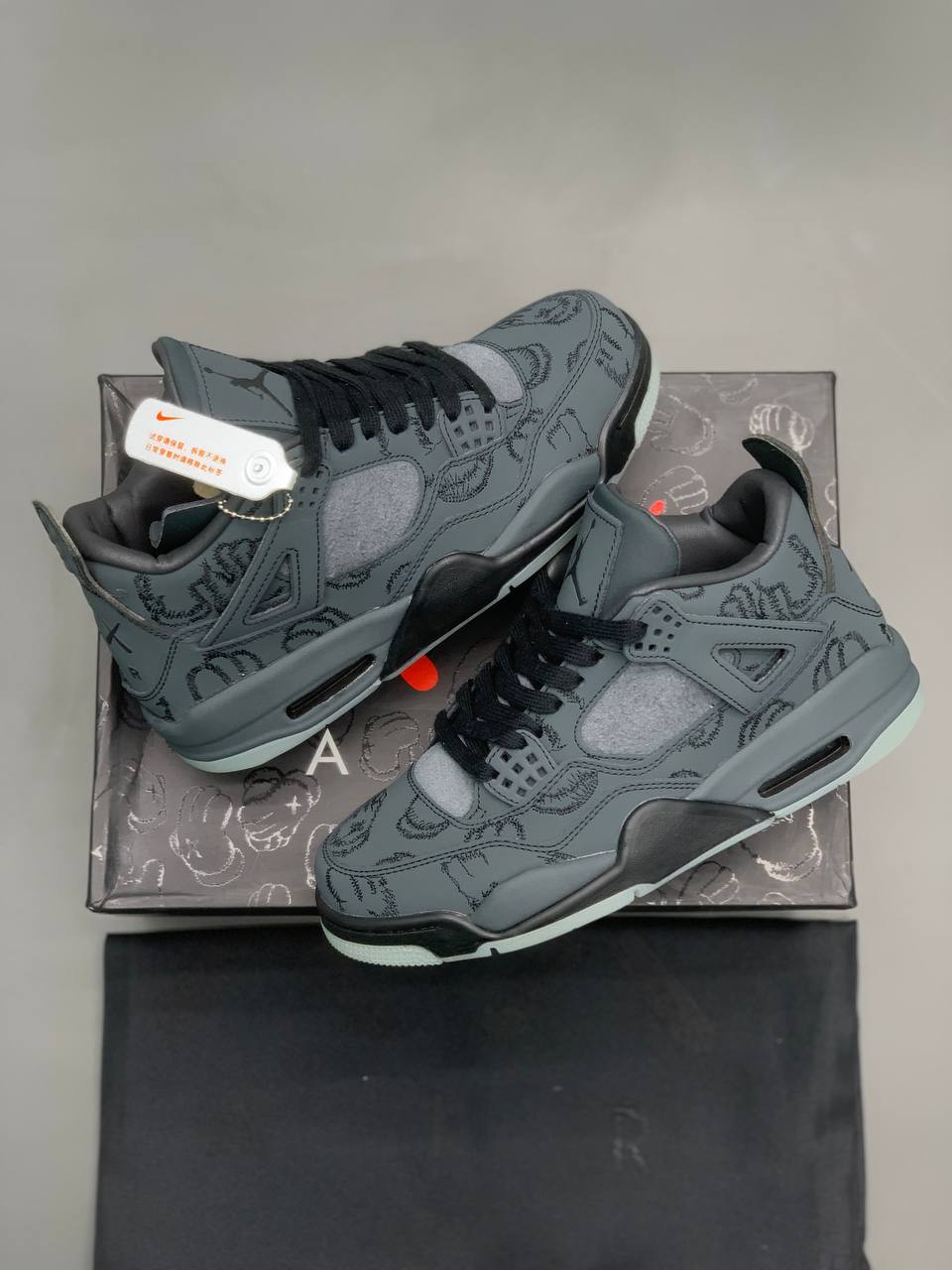 کتونی نایک Air Jordan 4 Retro x Kaws black suede luminous Nike Air Jordan 4 Retro x Kaws black suede luminous