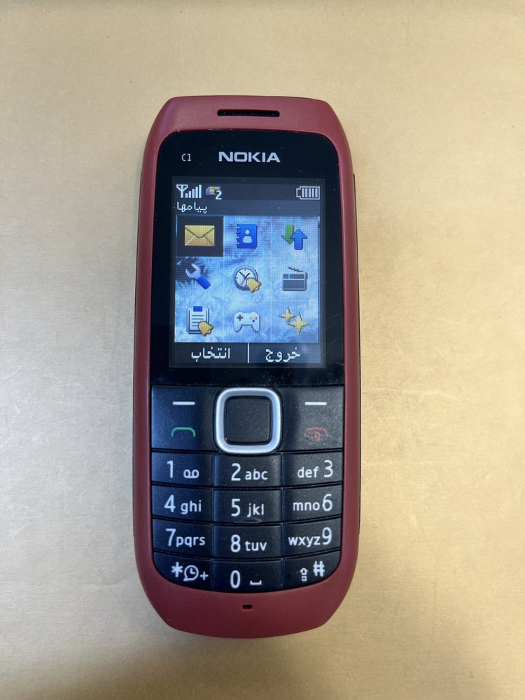 گوشی نوکیا NOKIA c1-00 (کارکرده) اصلی قدیمی روشن داخل شبکه و قابل استفاده منو فارسی (شارژر اصلی) “اصالت کالا”:”اورجینال” وضعیت ریجستری” ریجسترشده و داخل شبکه” و قابل استفاده