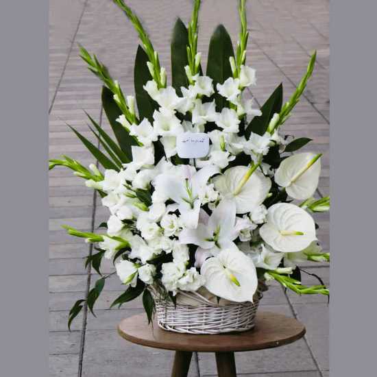 Dena White Gladiolus and Anthurium Flower Basket for Funeral